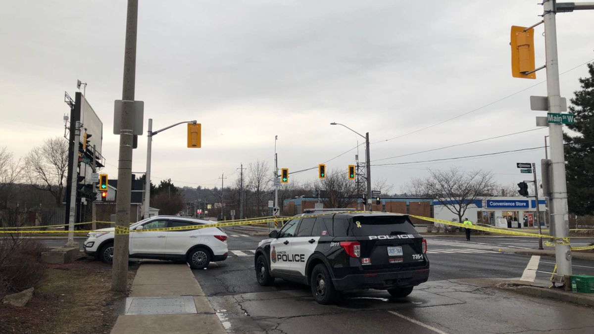 Hamilton police in the area of Main Street West and Dundurn Street South where a teenage girl was struck by a vehicle in the afternoon of March 30, 2022.