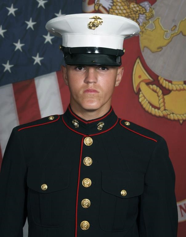 In this undated photo released by the 1st Marine Division, Camp Pendleton/U.S. Marines is Marine Corps Lance Cpl. Rylee J. McCollum, 20. His family has filed a defamation lawsuit against actor Alec Baldwin.