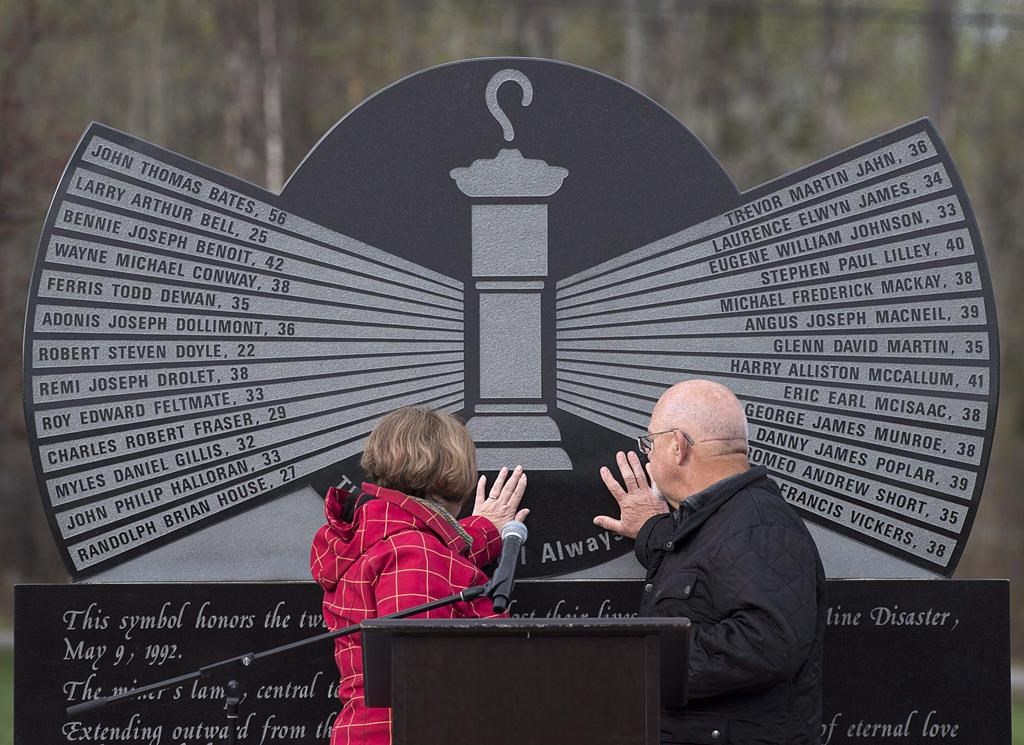 Allen and Debbie Martin touch the monument engraved with the names of the 26 coal miners who perished in the Westray mine disaster, at the Westray Miners Memorial Park in New Glasgow, N.S. on May 9, 2017. Allen's brother, Glenn Martin, was killed when the coal mine exploded on May 9, 1992. Family members who lost loved ones in the disaster will mark the 30th anniversary of their deaths today in a ceremony at the memorial park. 