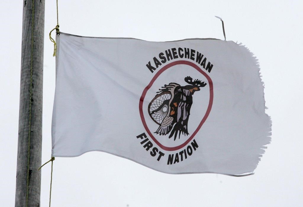 A tattered Kashechewan First Nation flag flies outside St. Paul's Anglician church on the Kashechewan native reserve in northern Ontario Sunday, Oct. 30, 2005.