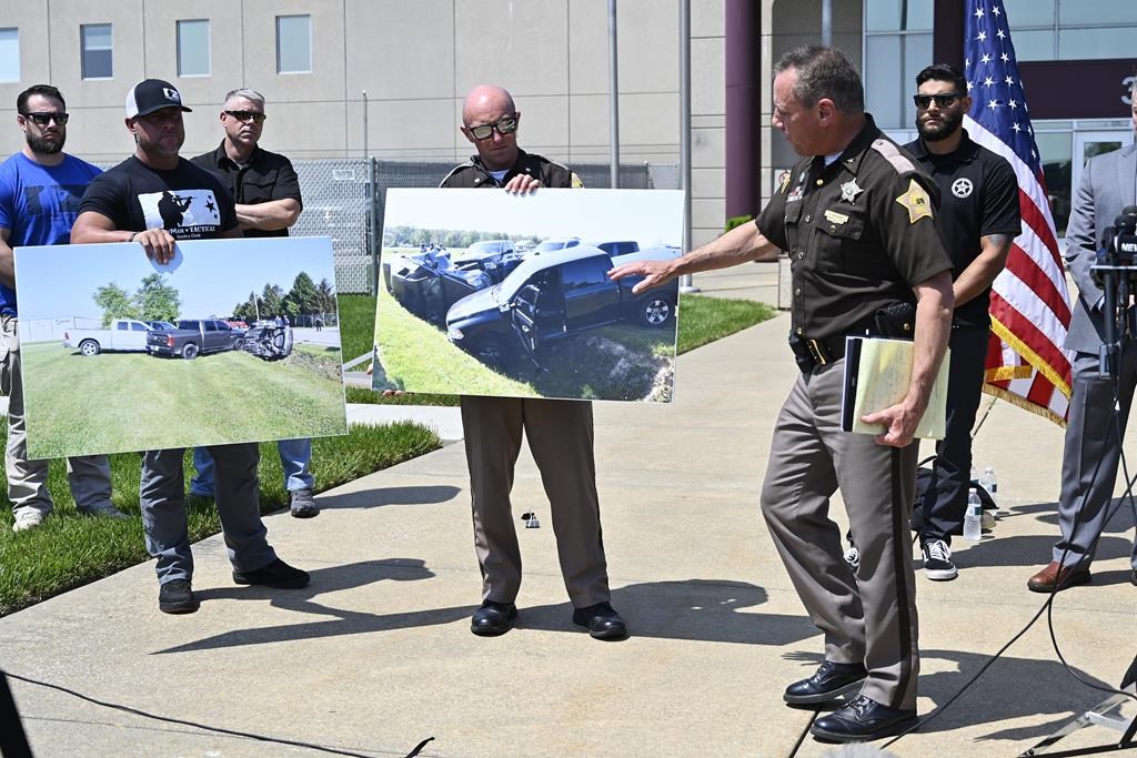 Vandenburgh County Sheriff Dave Wedding, right, refers to a photograph during a press conference in Evansville, In., Tuesday, May 10, 2022, about the capture of fugitives Casey White and Vicky White.