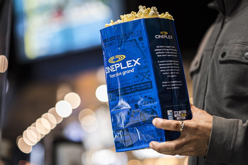 Customers buy popcorn at a Cineplex theatre in downtown Toronto on Wednesday, Aug. 26, 2020. Cineplex Inc. reported a first-quarter loss of $42.2 million in its latest quarter as its revenue soared with customers returning to movie theatres. THE CANADIAN PRESS/Christopher Katsarov.