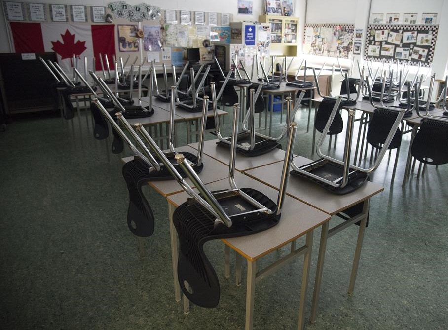 An empty classroom is pictured at Eric Hamber Secondary school in Vancouver, B.C., Monday, March 23, 2020. Newfoundland and Labrador's plan for the upcoming school year aims to maximize in-class attendance with the option for schools to return to remote learning if COVID-19 risk increases. THE CANADIAN PRESS/Jonathan Hayward.