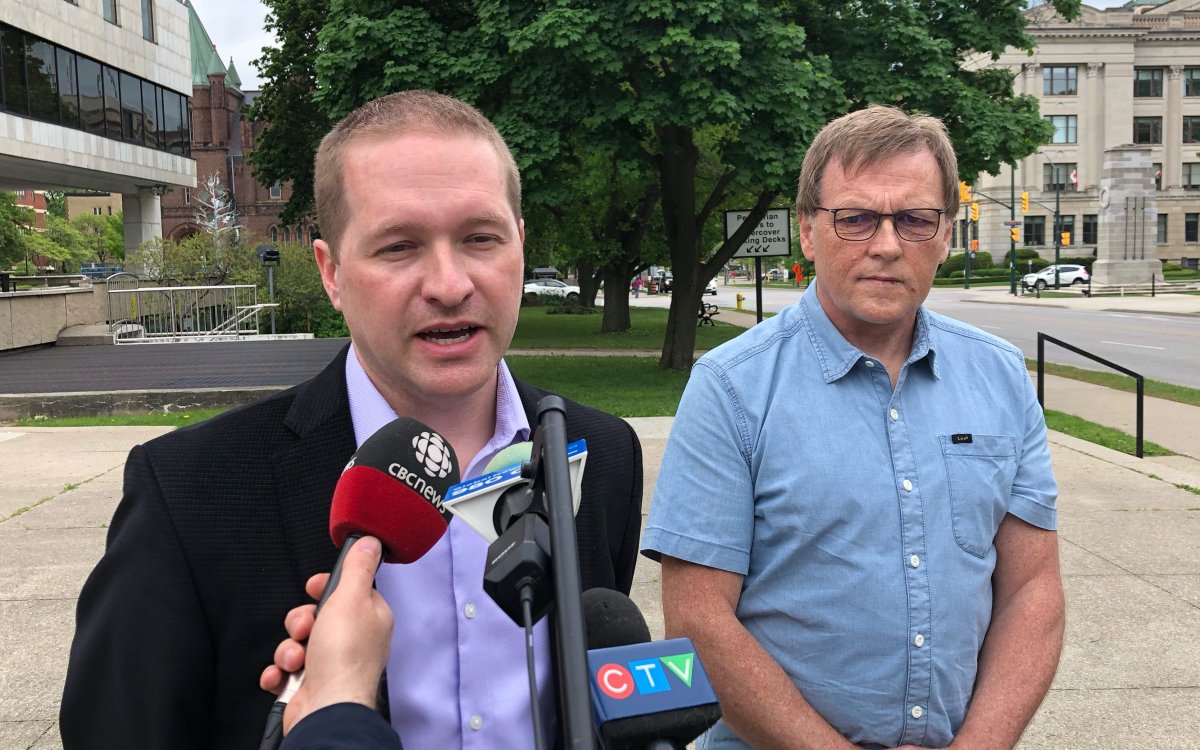 Deputy mayor and 2022 mayoral candidate Josh Morgan and former city manager Martin Hayward outside of London, Ont. city hall on May 26, 2022.