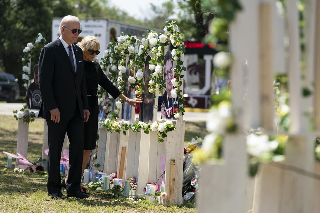 President Joe Biden and first lady Jill Biden visit a memorial at Robb Elementary School to pay their respects to the victims of the mass shooting, Sunday, May 29, 2022, in Uvalde, Texas.