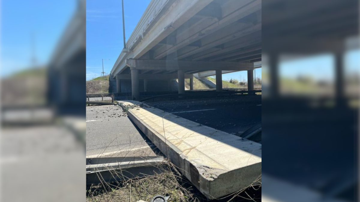 OPP closed off Highway 403 at the Wayne Gretzky Parkway in Brantford after part of a bridge fell onto the highway on the afternoon of  May 9, 2022.