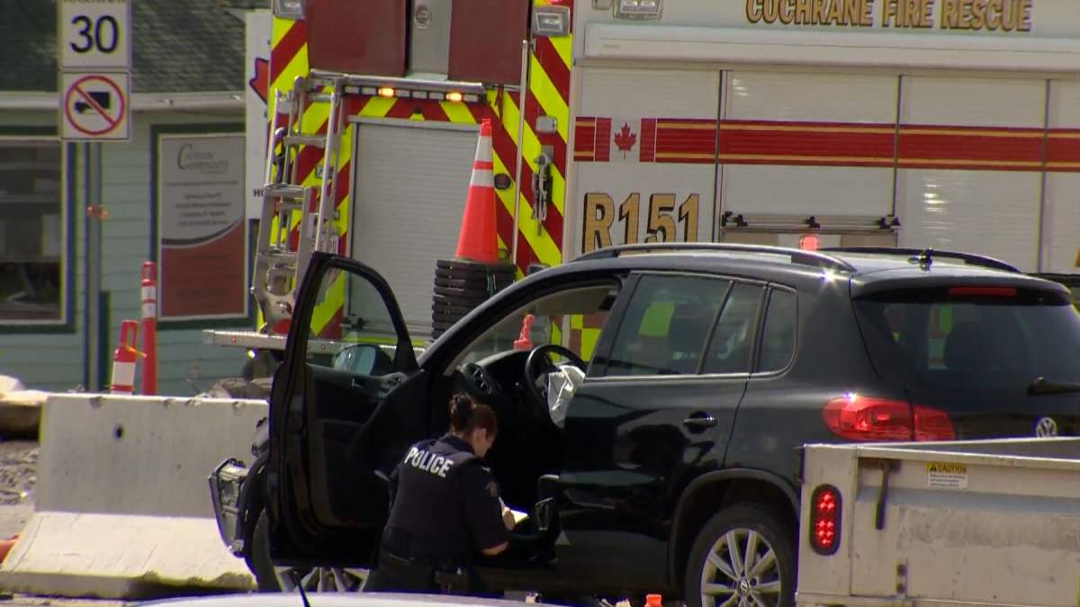 Officers investigate a serious collision in Cochrane, Alta., on May 24, 2022.