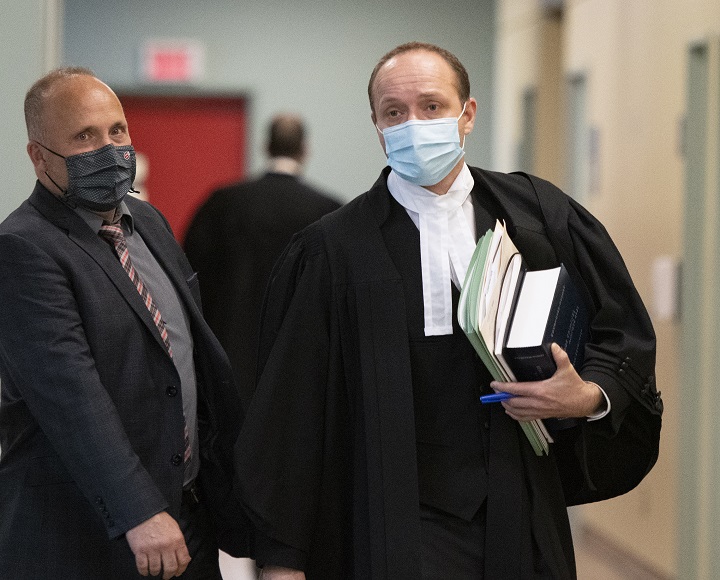 Quebec Crown prosecutor Francois Godin, right, walks to a courtroom, Thursday, November 5, 2020  in Quebec City. 