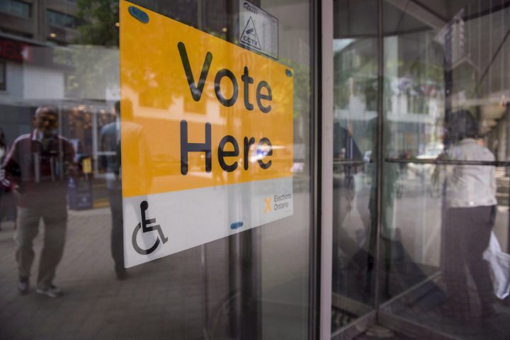 An Elections Ontario sign is seen at University - Rosedale voting location at the Toronto Reference Library on Thursday, June 7, 2018. 