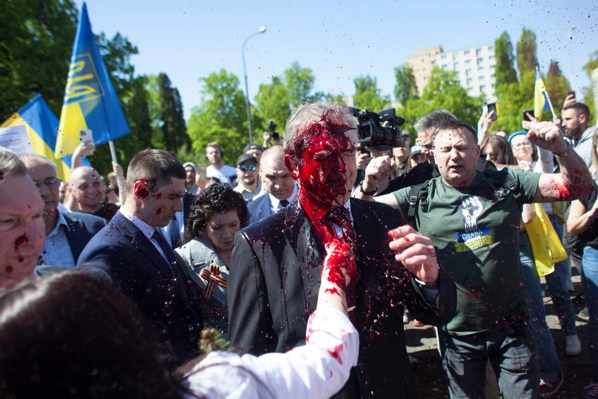 Russian Ambassador to Poland, Ambassador Sergey Andreev is covered with red paint in Warsaw, Poland, Monday, May 9, 2022.