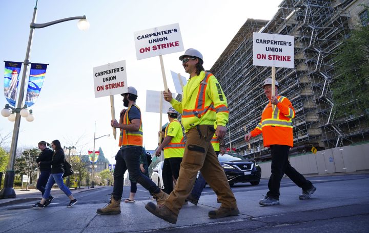 Unionized commercial carpenters from the Ontario Chapter of the United Brotherhood of Carpenters and Joiners of America, picket in Ottawa on Wednesday, May 11, 2022. 