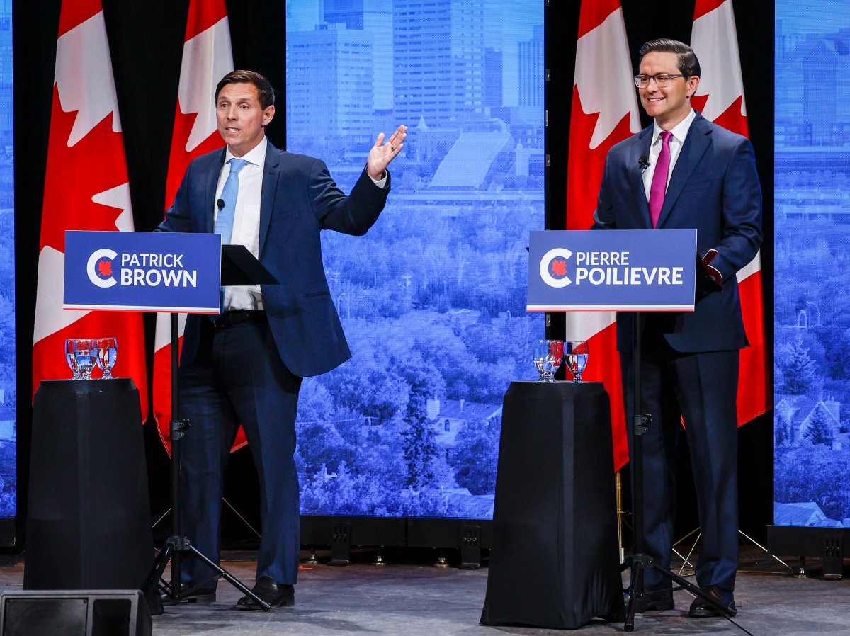 Patrick Brown, left, and Pierre Poilievre trade barbs at the Conservative Party of Canada English leadership debate in Edmonton, Alta., Wednesday, May 11, 2022.