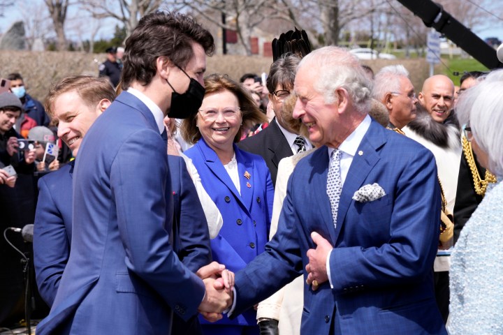 Prime Minister Justin Trudeau greets Prince Charles and Camilla, Duchess of Cornwall as they arrive in St. John's to begin a three-day Canadian tour, Tuesday, May 17, 2022.