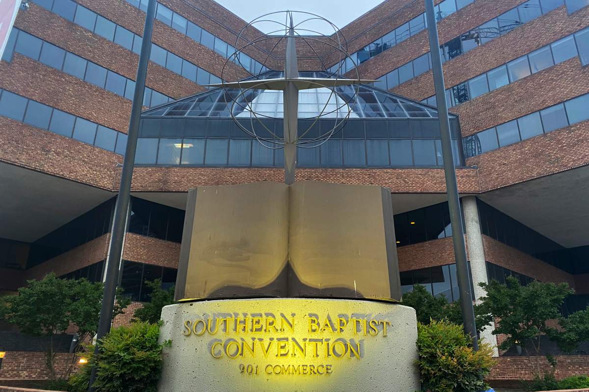 A cross and Bible sculpture stand outside the Southern Baptist Convention headquarters in Nashville, Tenn., on Tuesday, May 24, 2022.
