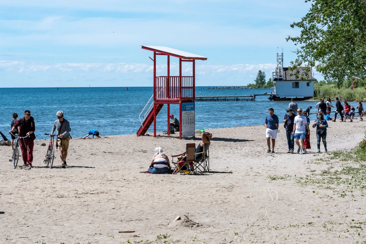 General view of people enjoying the nice weather at Cherry Beach while observing social distancing in downtown Toronto on June 14, 2020.