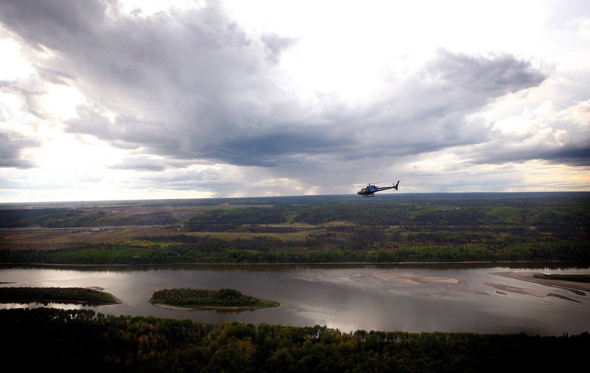 A helicopter in air over the Athabasca River near Fort McMurray, Alta., Monday, Sept. 19, 2011.