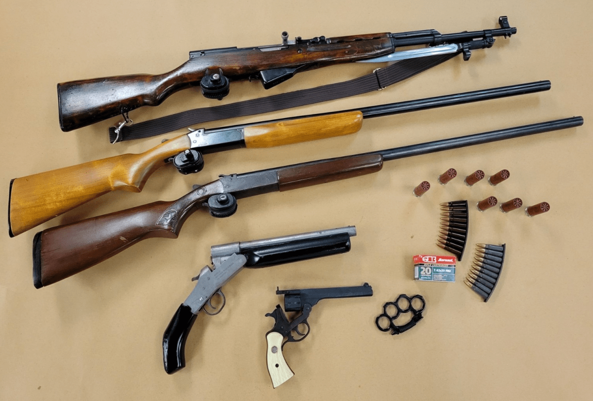 Guns and ammunition seized by London police on May, 19, 2022.