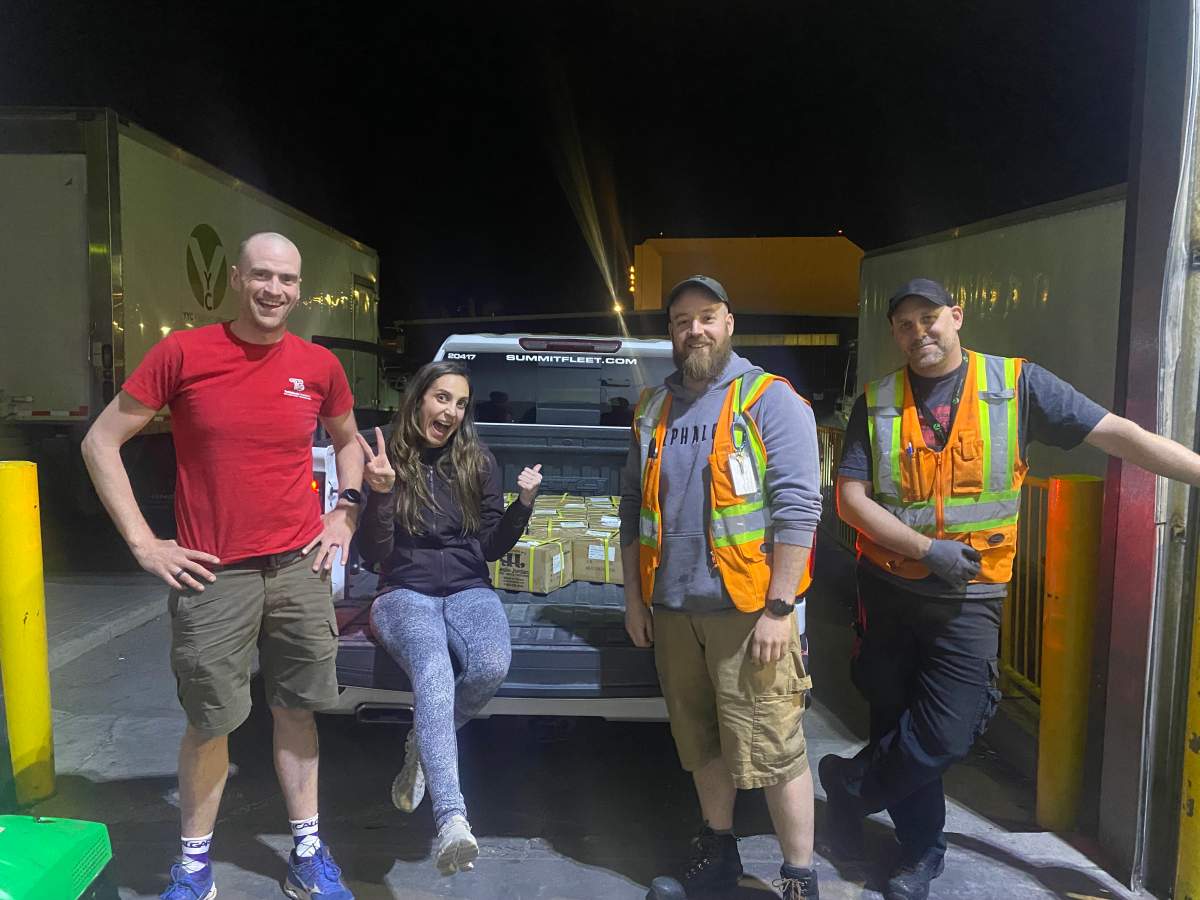 Servus Calgary Marathon medals are picked up from WestJet cargo in Calgary after midnight on May 29, 2022.