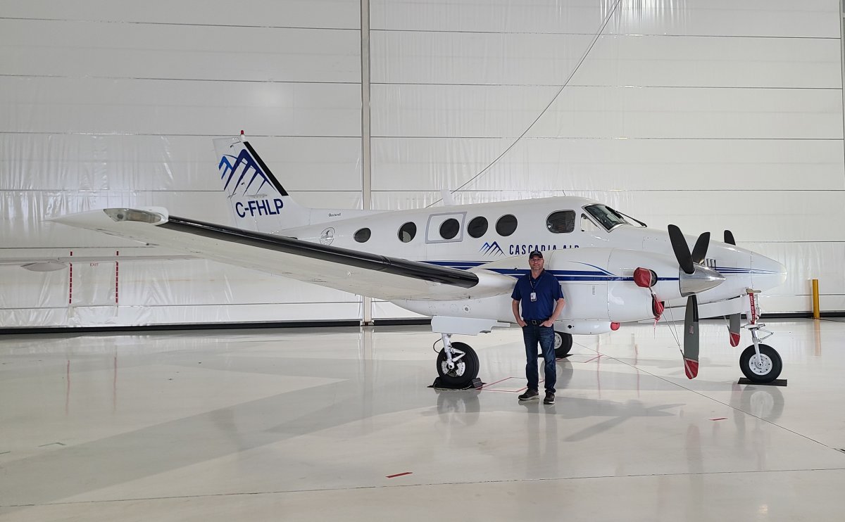 Cascadia Air president Jeremy Barrett with a company plane. 
