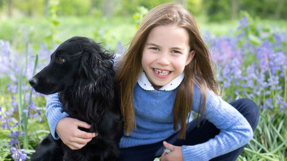 Princess Charlotte poses with her family's new dog, Orla, in photos released ahead of her seventh birthday.