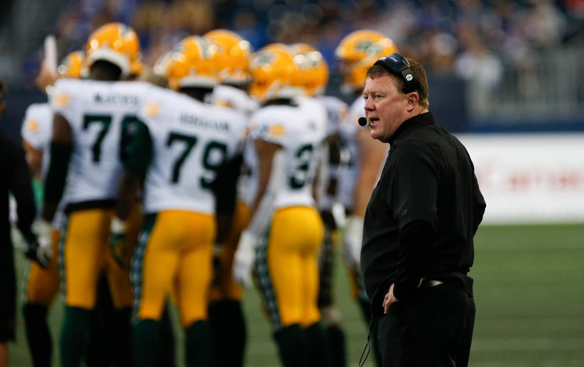Edmonton Elks head coach Chris Jones on the sideline  during the first half of pre-season CFL action against the Winnipeg Blue Bombers in Winnipeg, Friday, May 27, 2022. THE CANADIAN PRESS/John Woods.