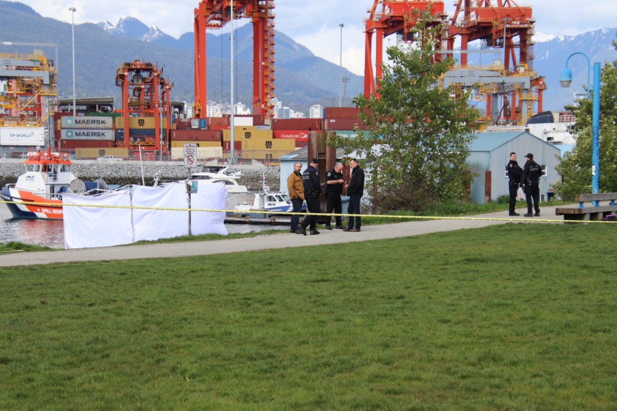 Police tape and a visual barrier erected in Vancouver's Crab Park on Saturday. 