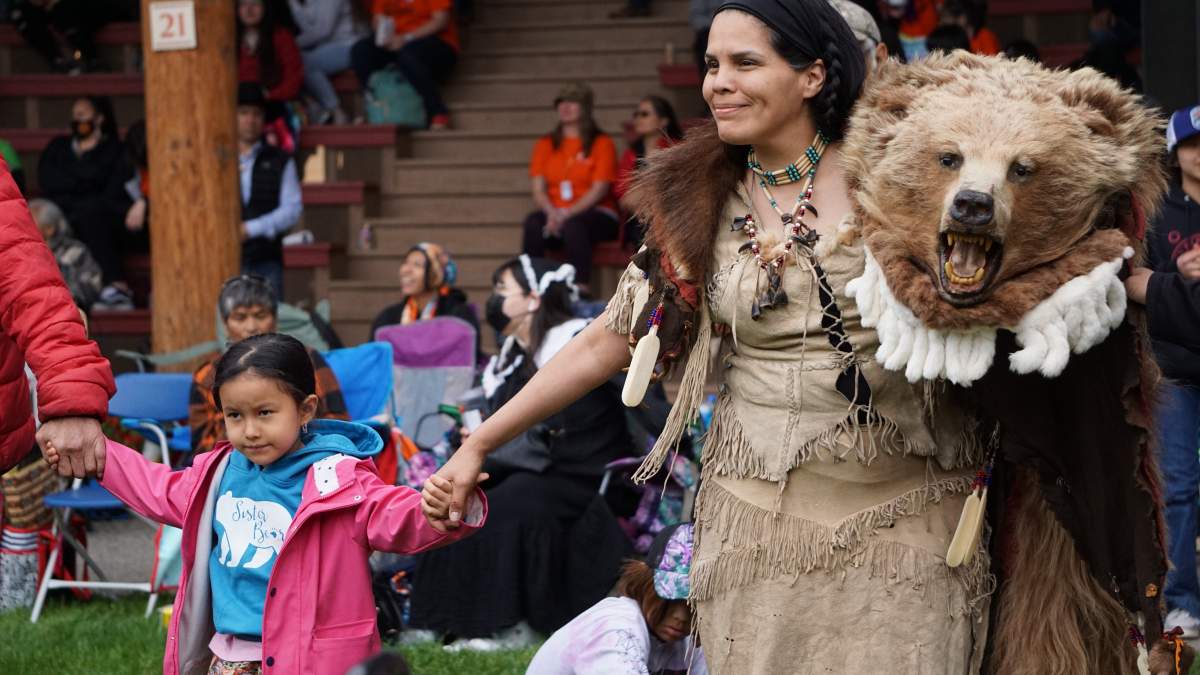 St’át’imc bear dancer and intergenerational survivor Jackie Andrew takes part in a round dance in the Tk’emlúps te Secwépemc Powwow Arbour on May 23, 2022.