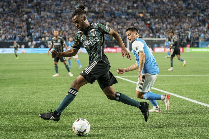 LA Galaxy forward Raheem Edwards keeps the ball away from Charlotte FC forward Cristian Ortiz during the first half of an MLS soccer match in Charlotte, N.C., Saturday, March 5, 2022.