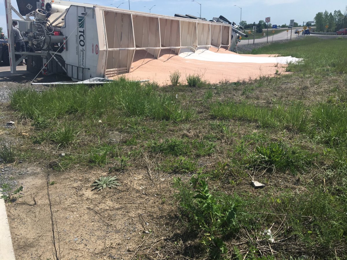 A truck carrying fertilizer rolled over on a 401 off-ramp in Kingston.