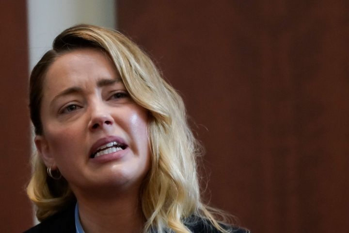 Actor Amber Heard testifies about the first time her ex-husband, actor Johnny Depp hit her, at Fairfax County Circuit Court during a defamation case against her by Depp in Fairfax, Va., on May 4, 2022.
