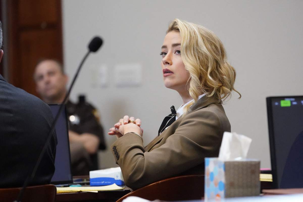 US actress Amber Heard listens in the courtroom at the Fairfax County Circuit Courthouse in Fairfax, Virginia, on May 23, 2022.