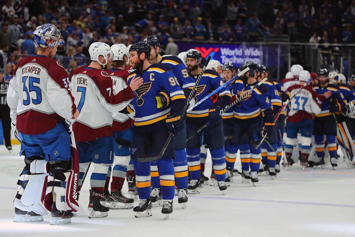 The St. Louis Blues shake hands after losing to the Colorado Avalanche in Game six of the Second Round of the 2022 Stanley Cup Playoffs at Enterprise Center on May 27, 2022 in St Louis, Missouri.