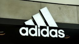 An Adidas sign at the entrance to the store on August 12, 2021 in Miami, Florida.