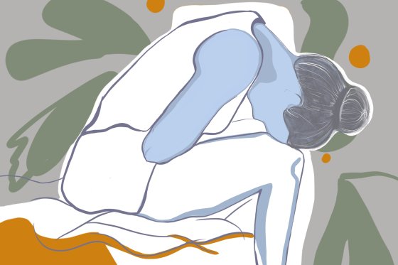 An illustration of a young woman with menstrual pain sitting on a bed at home.