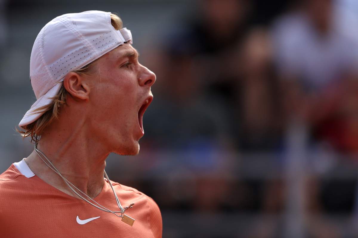 Denis Shapovalov yells after winning a set