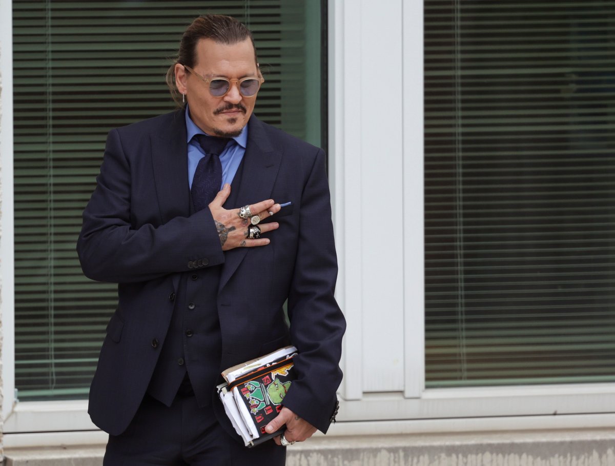 Actor Johnny Depp takes a break during his trial at a Fairfax County Courthouse on May 27, 2022 in Fairfax, Virginia.