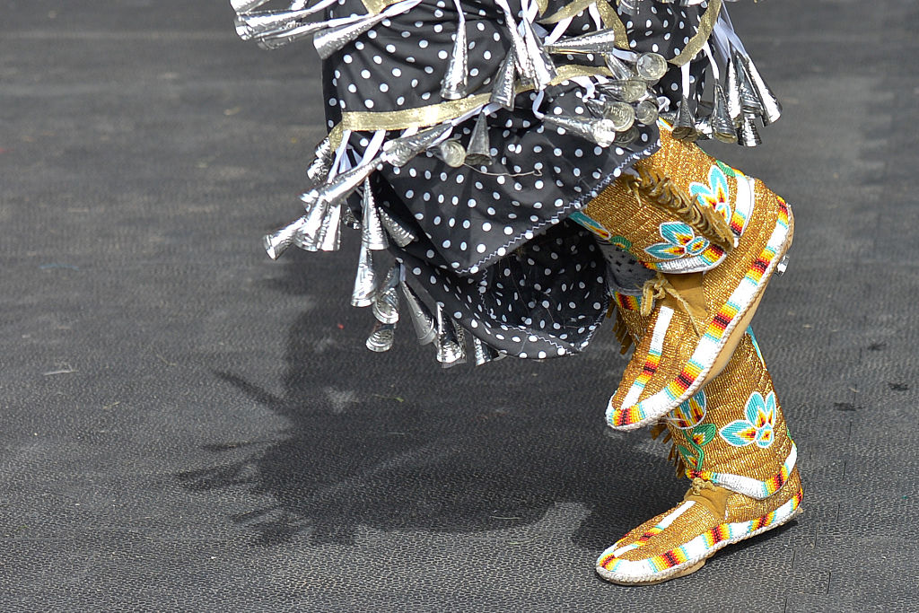 Details of the traditional costumes by young members of the First Nations during a traditional Powwow competition, during Calgary Stampede 2016.