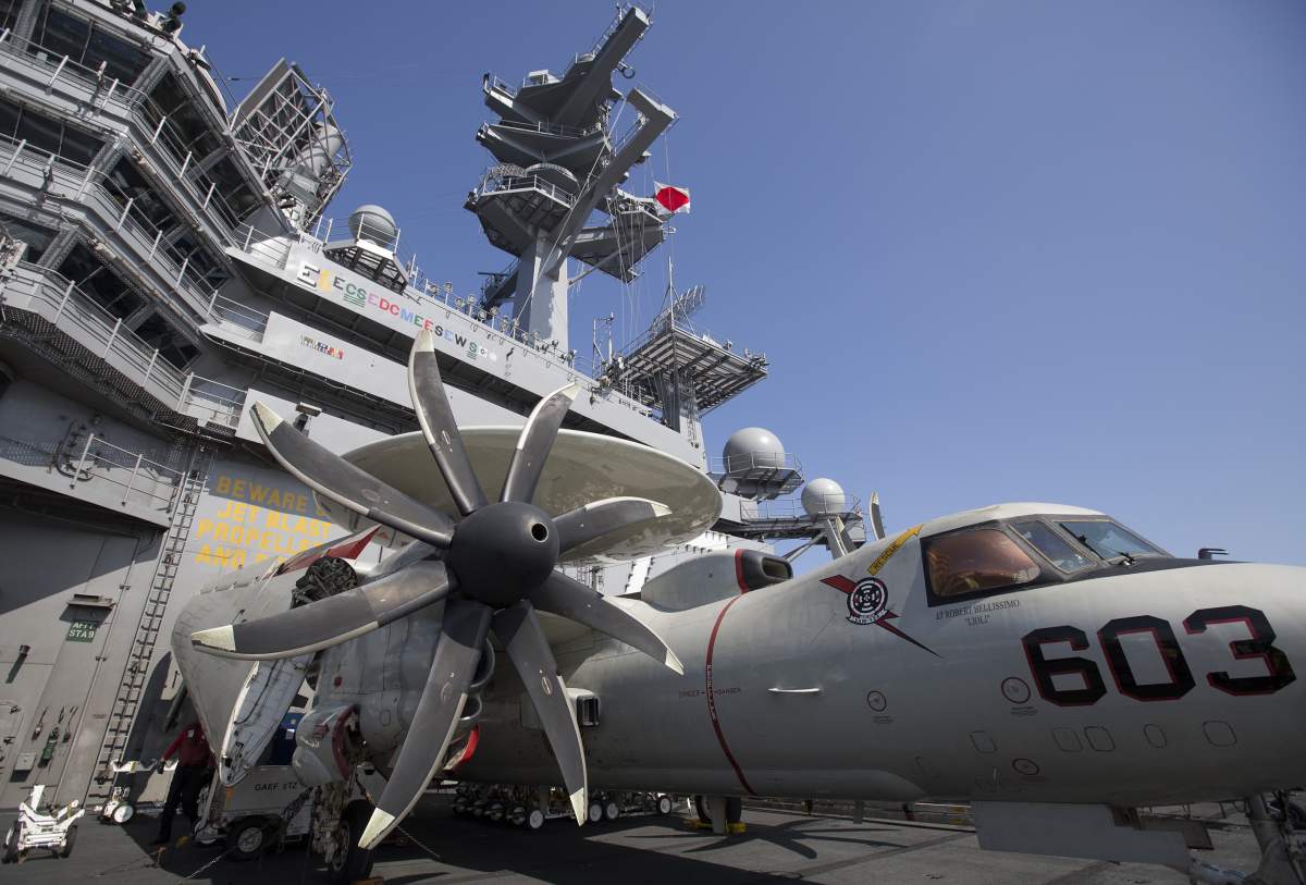 F/A-18 Super Hornet and F/A-18 Hornet warplanes are seen on the flight deck of U.S. aircraft carrier USS George Washington in this file photo.