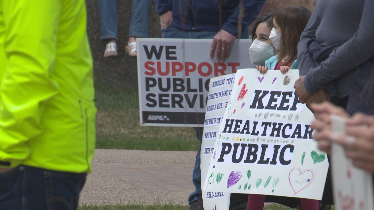 People rallied at Lethbridge City Hall in support of public health care in the province on May 14, 2022.