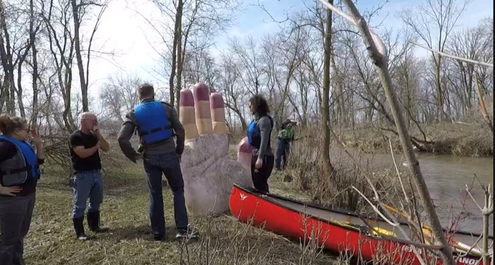 A statue of a hand that disappeared after it washed off the bank of a swollen river in Winnipeg earlier this week has been rescued, thanks to a group of canoeists and kayakers.
