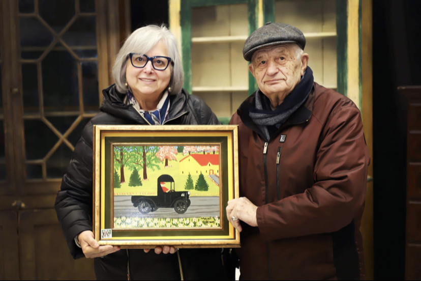 Irene and Tony Demas with the Maud Lewis painting they have had for nearly 50 years after acquiring it through a regular customer at their London, Ont., restaurant the Villa.  