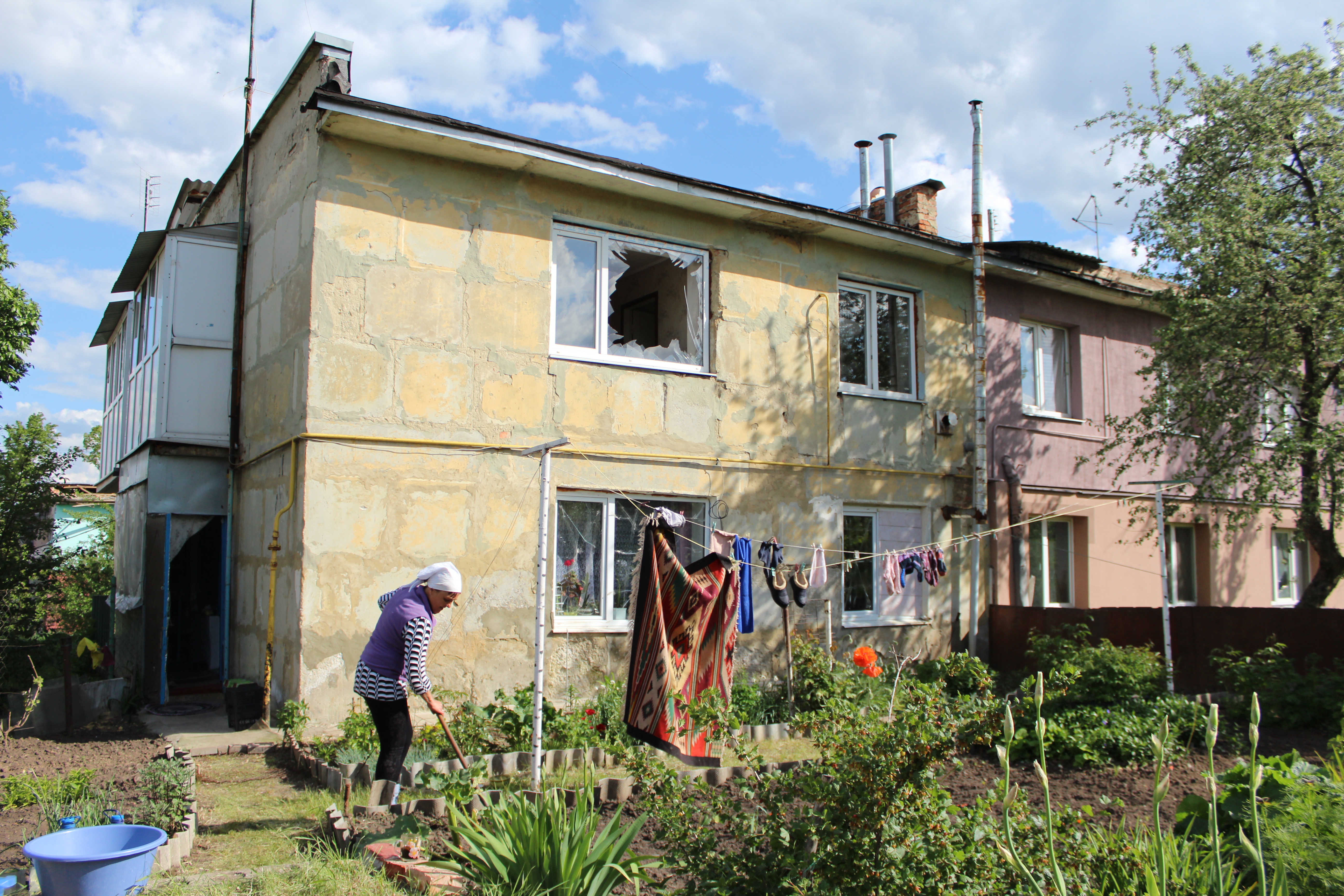 Olena Bobrysheva in her garden on School Street, Vilkhivka, Ukraine, May 19, 2022.