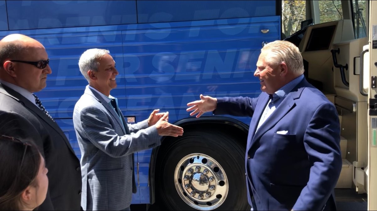 Progressive Conservative Leader Doug Ford is greeted by London North Centre PC candidate Jerry Pribil during a campaign stop in London, Ont., on Thursday.