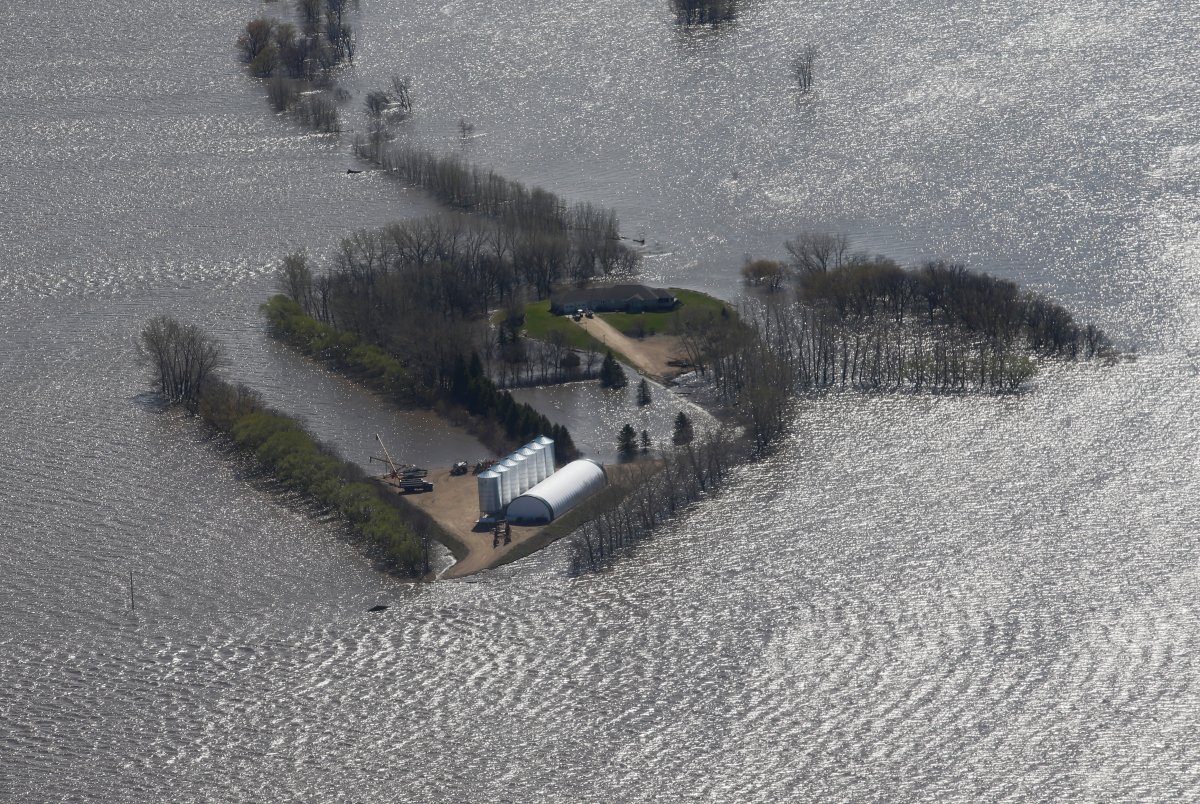 Some properties along Highway 75 are isolated due to Red River flooding south of Winnipeg, Sunday, May 15, 2022.