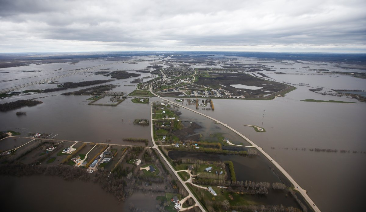St Adolphe, Man., which runs along Highway 75, is protected against Red River flooding by a dike south of Winnipeg, Sunday, May 15, 2022.