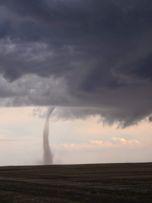 Environment Canada confirms that a land spout tornado touched down near Keeler, Sask. where nearby residents took videos and photos to social media.