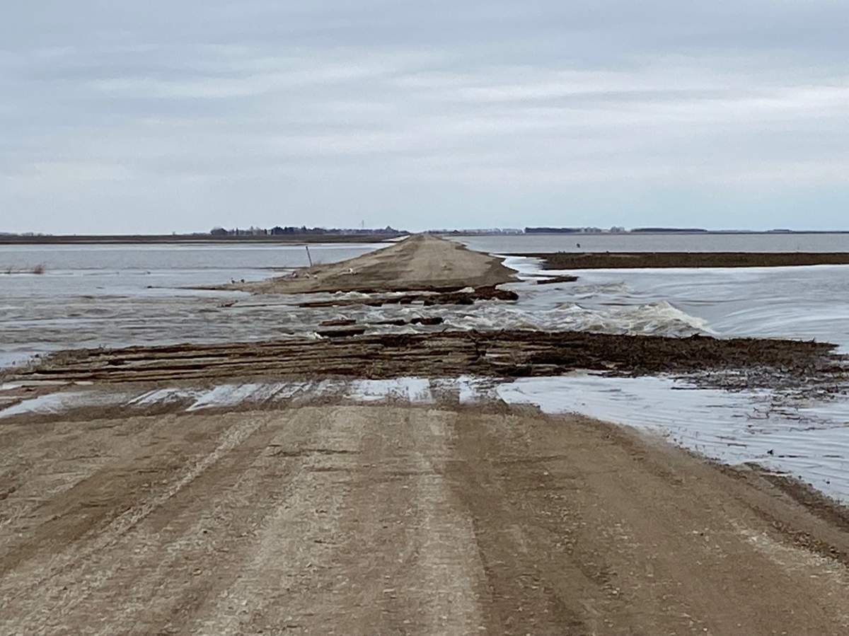 A road is washed out due to flooding in St Jean Baptiste area Monday.