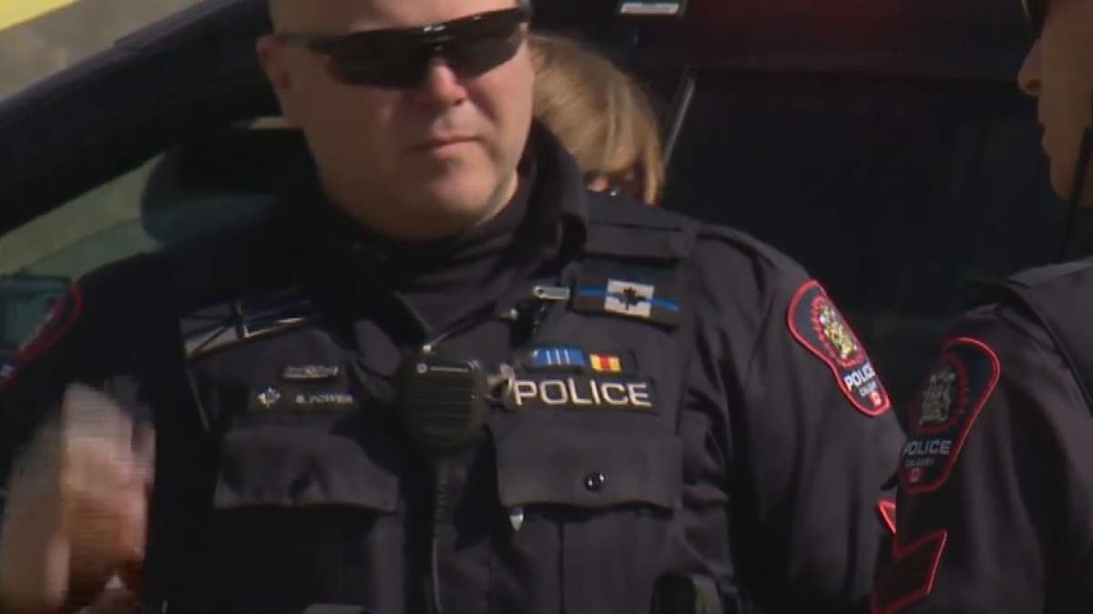 A Calgary police officer is seen wearing a thin blue line patch on the upper right of his uniform, in an undated photo.