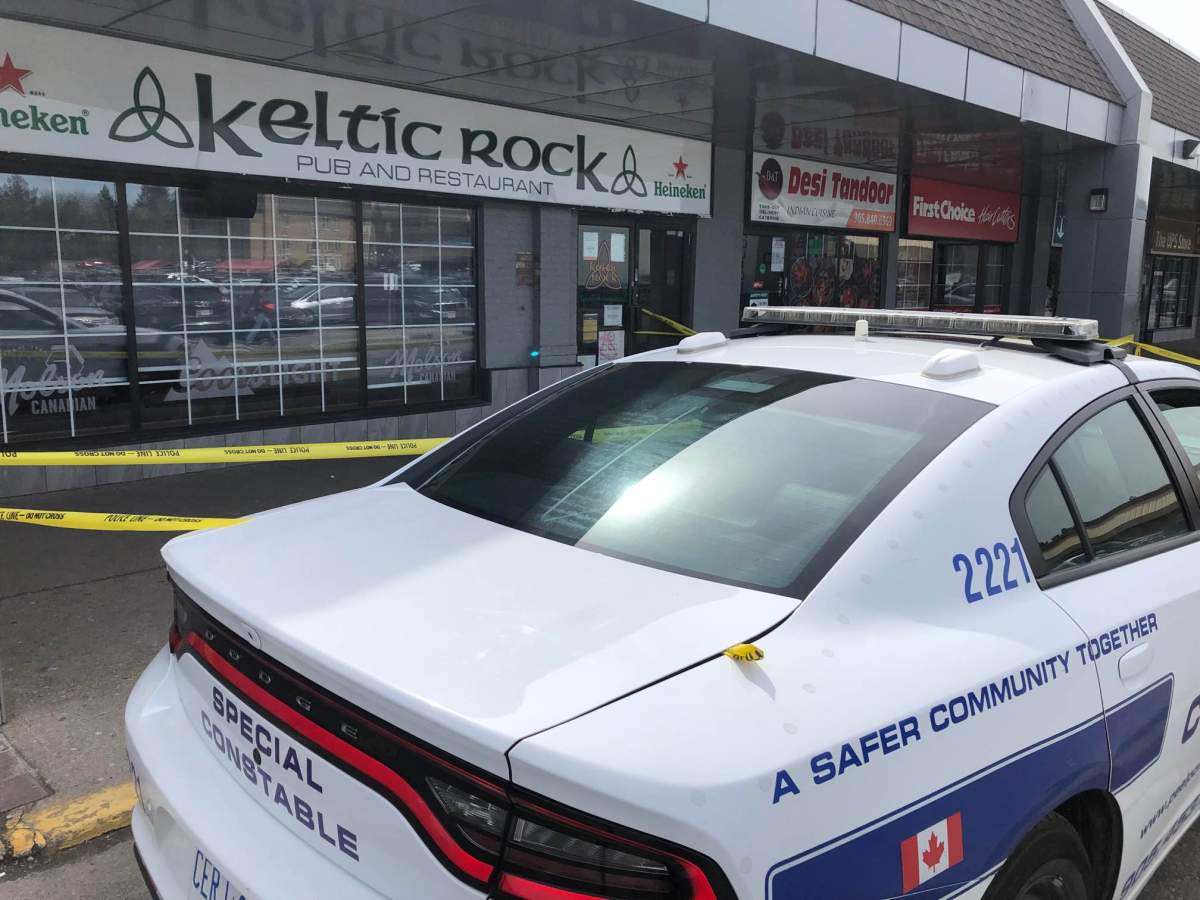 Police at the scene following a shooting near Kennedy Road and Sandalwood Parkway on April 30, 2022.
