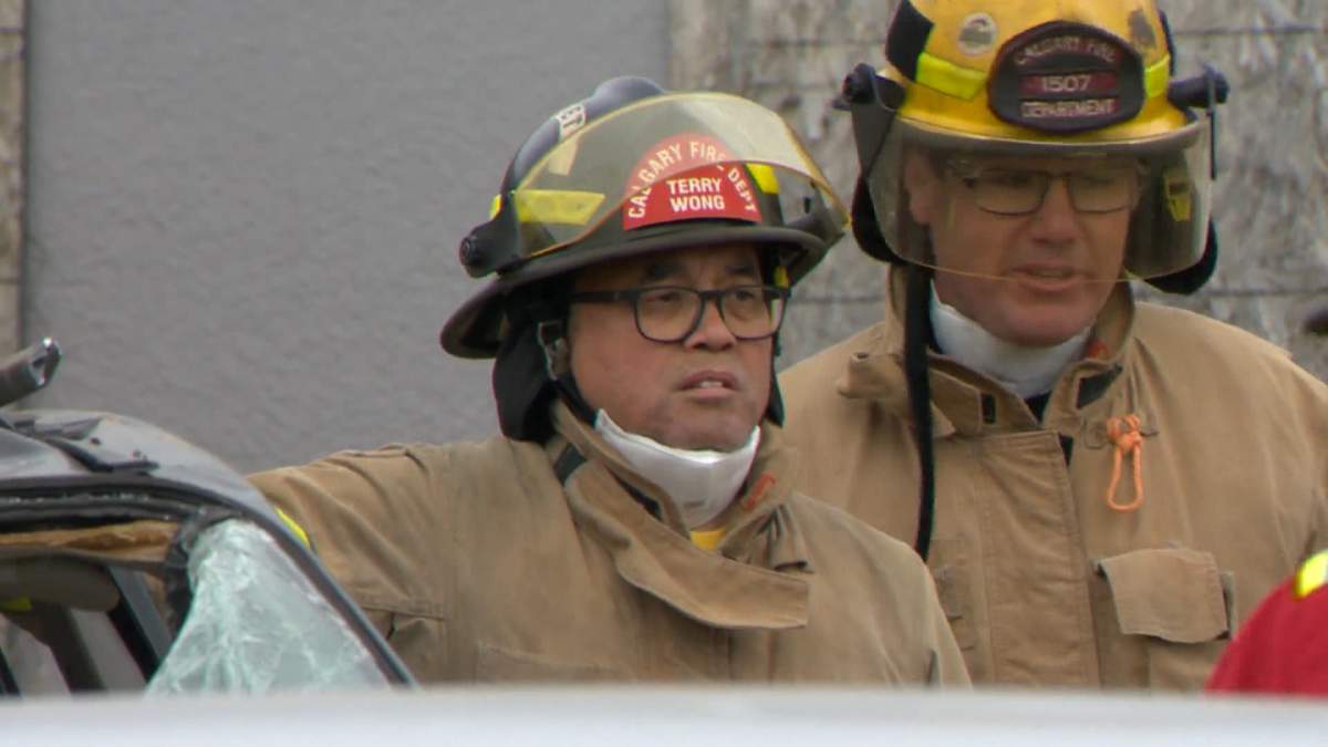 Calgary Coun. Terry Wong is seen in full firefighter on May 30, 2022, as part of a firefighter training experience for city council.